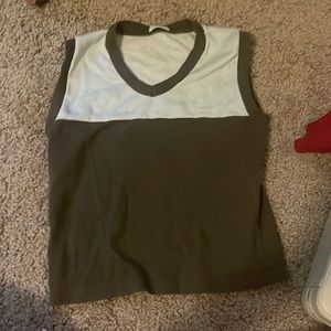 a combination of tan & brown john galt tank top with a V neck.